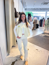 Kurze Teddy Weste mit Knopfleiste und Smiley Creme