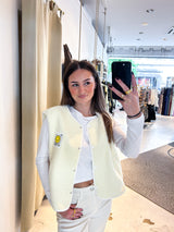 Kurze Teddy Weste mit Knopfleiste und Smiley Creme