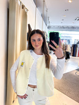 Kurze Teddy Weste mit Knopfleiste und Smiley Creme