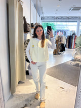 Kurze Teddy Weste mit Knopfleiste und Smiley Creme