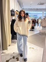Oversized Strickpullover mit Stehkragen und farbigen Details Beige