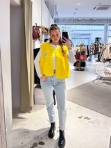 Kurze Teddy Weste mit Knopfleiste und Smiley Gelb