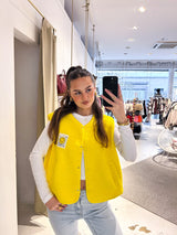 Kurze Teddy Weste mit Knopfleiste und Smiley Gelb