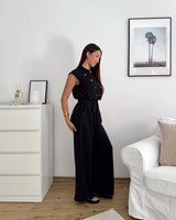 Jumpsuit mit Zierknöpfen Schwarz