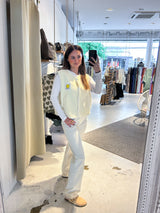 Kurze Teddy Weste mit Knopfleiste und Smiley Creme