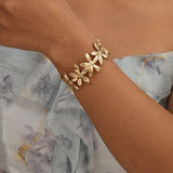 Viele Blumen Edelstahl Armreif Gold