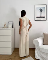 Jumpsuit mit Zierknöpfen Beige